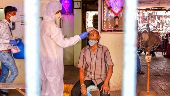 A heath worker conducts Covid-19 testing of a man at Dadar market, amid a surge in coronavirus cases across Maharashtra, in Mumbai. (HT file photo) A heath worker conducts Covid-19 testing of a man at Dadar market, amid a surge in coronavirus cases across Maharashtra, in Mumbai. (HT file photo)