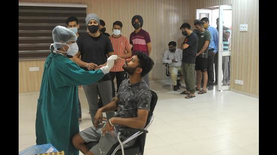 Hostellers getting sampled for Covid test at Punjab Engineering College in Chandigarh on Thursday. (Ravi Kumar/HT) Hostellers getting sampled for Covid test at Punjab Engineering College in Chandigarh on Thursday. (Ravi Kumar/HT)