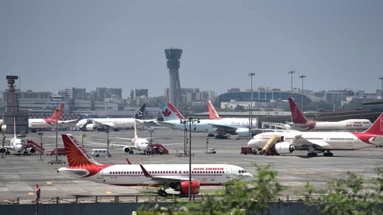 Planes are seen parked at Mumbai airport as many flights were cancelled during the outbreak of the coronavirus on March 21, 2020.(Satish Bate/HT File Photo)