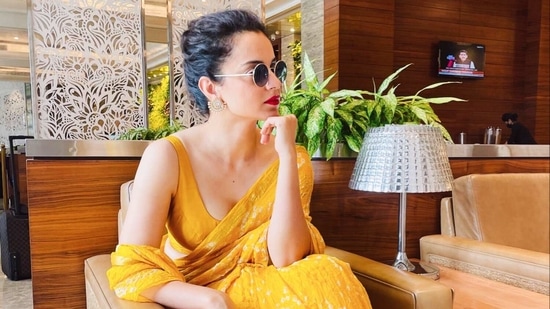 Kangana Ranaut poses in a yellow saree.