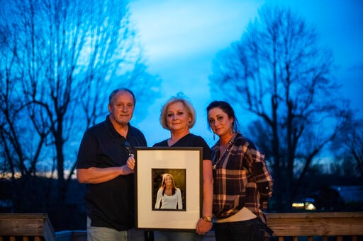 Jeff and Lola Carter stand with their daughter, Amanda, and a framed photo of Kayla, their daughter who struggled with drug addiction.(AP) Jeff and Lola Carter stand with their daughter, Amanda, and a framed photo of Kayla, their daughter who struggled with drug addiction.(AP)