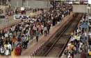 Commuters rush to board a suburban train at CSMT station prior to the night curfew in Mumbai. (ANI Photo) Commuters rush to board a suburban train at CSMT station prior to the night curfew in Mumbai. (ANI Photo)