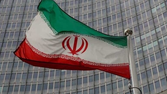 An Iranian flag flutters in front of the International Atomic Energy Agency (IAEA) headquarters in Vienna, Austria.(File Photo / REUTERS)