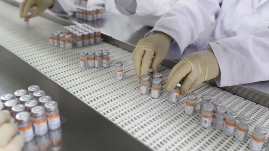 Employees pick up vials containing CoronaVac, Sinovac's vaccine against Covid-19, in Sao Paulo, Brazil. (REUTERS / File)