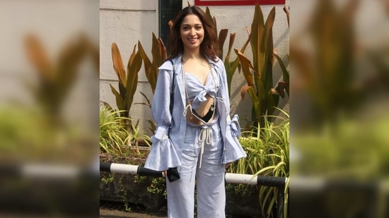 While flaunting her toned midriff, she teamed it with a pair of matching wide-legged pants that also had a tie detail in the front for that extra comfort. (Varinder Chawla) While flaunting her toned midriff, she teamed it with a pair of matching wide-legged pants that also had a tie detail in the front for that extra comfort. (Varinder Chawla)