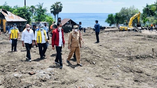 President Joko Widodo (C) inspecting damage on Lembata Island after torrential rains from Tropical Cyclone Seroja, (AFP)