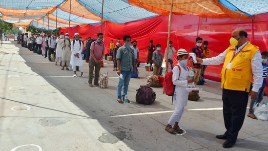 In this file picture from May 2020, a child undergoes thermal screening before boarding a special train in Moradabad. The district has imposed a night curfew as cases rise across the state. (PTI Photo) In this file picture from May 2020, a child undergoes thermal screening before boarding a special train in Moradabad. The district has imposed a night curfew as cases rise across the state. (PTI Photo)