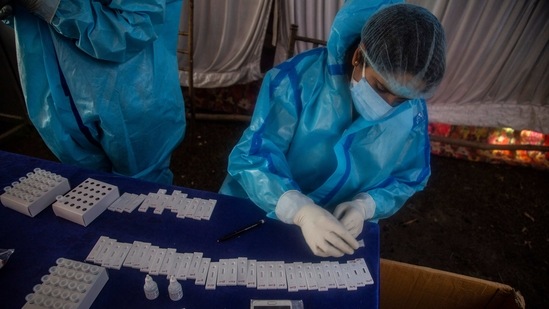 A Kashmiri health worker tests nasal swab samples for COVID-19 in Srinagar, Indian-controlled Kashmir, Monday, April 5, 2021. India’s daily confirmed coronavirus cases have recorded the biggest single-day spike since the pandemic began, indicating a renewed crush of infections. (AP Photo/Mukhtar Khan) (AP) A Kashmiri health worker tests nasal swab samples for COVID-19 in Srinagar, Indian-controlled Kashmir, Monday, April 5, 2021. India’s daily confirmed coronavirus cases have recorded the biggest single-day spike since the pandemic began, indicating a renewed crush of infections. (AP Photo/Mukhtar Khan) (AP)