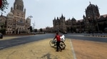 A man walks with his bicycle in front of the Brihanmumbai Municipal Corporation (BMC) building and the Chhatrapati Shivaji Maharaj Terminus (CSMT) in Mumbai. (REUTERS) A man walks with his bicycle in front of the Brihanmumbai Municipal Corporation (BMC) building and the Chhatrapati Shivaji Maharaj Terminus (CSMT) in Mumbai. (REUTERS)