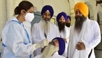 A health department worker testing pilgrims, headed to Pakistan to celebrate Baisakhi festival, for Covid-19 at Golden Temple complex in Amritsar. (Photo by Sameer Sehgal /Hindustan Times) A health department worker testing pilgrims, headed to Pakistan to celebrate Baisakhi festival, for Covid-19 at Golden Temple complex in Amritsar. (Photo by Sameer Sehgal /Hindustan Times)