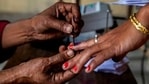 A polling officer applies indelible ink on the finger of a voter (AP Photo )