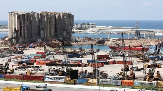 Vehicles drive near the grain silo that was damaged during Beirut port explosion, in Beirut, Lebanon April 9, 2021. (Reuters)