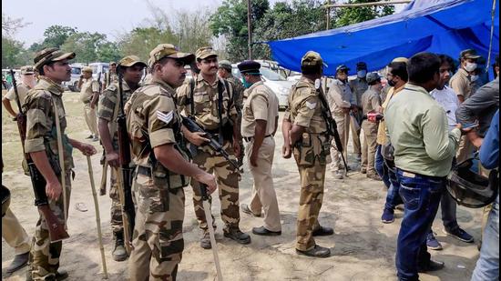 Security personnel keep vigil at a polling station after the Election Commission ordered that the voting exercise at polling station number 126 in Sitalkuchi should be stopped in Cooch Behar district on Saturday. (PTI PHOTO.) Security personnel keep vigil at a polling station after the Election Commission ordered that the voting exercise at polling station number 126 in Sitalkuchi should be stopped in Cooch Behar district on Saturday. (PTI PHOTO.)