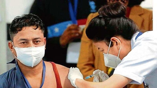 Sanitation worker Manish Kumar was vaccinated at AIIMS on January 16. (Reuters)