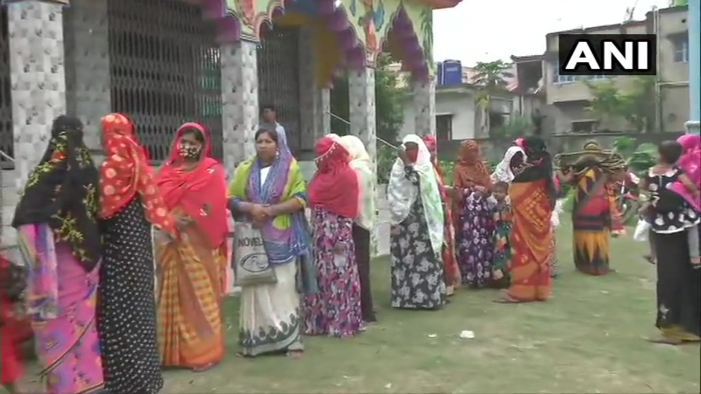 As voting began in the morning, long queues started form outside polling stations where polling will continue till 6.30 pm.