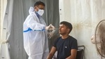 A health worker collects a swab sample for coronavirus test, at Nizamuddin Railway Station, in New Delhi, India.(Amal KS/HT Photo) A health worker collects a swab sample for coronavirus test, at Nizamuddin Railway Station, in New Delhi, India.(Amal KS/HT Photo)