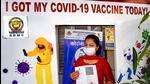 A woman poses for photographs after receiving a dose of the Covid-19 vaccine. during the vaccination festival 'Tika Utsav' at SDMC Urban Public Health Centre Daryaganj in New Delhi on Sunday. (PTI PHOTO.) A woman poses for photographs after receiving a dose of the Covid-19 vaccine. during the vaccination festival 'Tika Utsav' at SDMC Urban Public Health Centre Daryaganj in New Delhi on Sunday. (PTI PHOTO.)