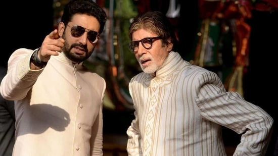 Amitabh Bachchan and Abhishek Bachchan caught in a candid moment.