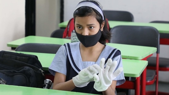 A student sanitizes her hands at City Montessori school in Lucknow, Uttar Pradesh. (Deepak Gupta / Hindustan Times) A student sanitizes her hands at City Montessori school in Lucknow, Uttar Pradesh. (Deepak Gupta / Hindustan Times)