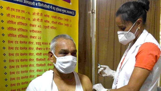 Chandigarh, India - April 11, 2021: An employee being vaccinated against Covid-19 on first day of Tika Utsav, at Bar room of Punjab and Haryana High Court in Chandigarh, India on Sunday, April 11, 2021. (Photo by Keshav Singh/Hindustan Times) Chandigarh, India - April 11, 2021: An employee being vaccinated against Covid-19 on first day of Tika Utsav, at Bar room of Punjab and Haryana High Court in Chandigarh, India on Sunday, April 11, 2021. (Photo by Keshav Singh/Hindustan Times)