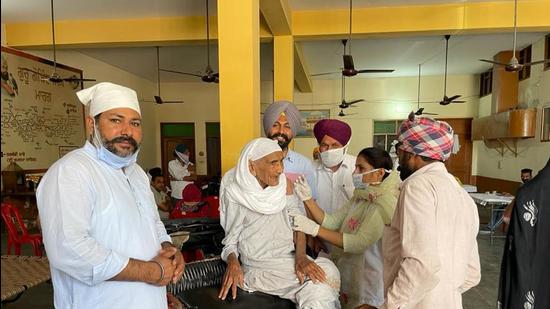 Kartar Kaur, of Moga’s Bhinder Khurd being vaccinated on Sunday. (HT photo)