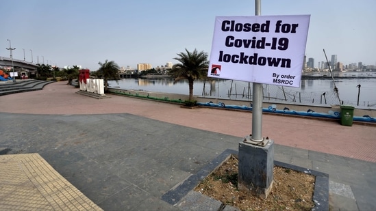 A public notice hangs in Bandra during the weekend lockdown imposed by the state government in wake of rising coronavirus cases, in Mumbai on April 10. Maharashtra’s vaccination milestone comes as the state is in the middle in a row with the Centre over claims of a vaccine shortage.(Satish Bate / HT Photo)