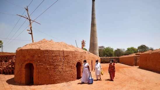 Healthcare workers arrive with doses of a Covid-19 vaccine to be administered to workers of a brick kiln at Kavitha village on the outskirts of Ahmedabad on April 8. Prime Minister Narendra Modi launched a four-day "Tika Utsav" on April 11 to push more eligible Indians to get a Covid-19 shot. (Amit Dave / REUTERS) Healthcare workers arrive with doses of a Covid-19 vaccine to be administered to workers of a brick kiln at Kavitha village on the outskirts of Ahmedabad on April 8. Prime Minister Narendra Modi launched a four-day "Tika Utsav" on April 11 to push more eligible Indians to get a Covid-19 shot. (Amit Dave / REUTERS)