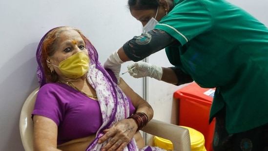 A woman reacts as she receives a dose of Covishield, a Covid-19 vaccine manufactured by Serum Institute of India, in Mumbai on April 11. India has administered more than 100 million doses since the middle of January, the most after the United States and China. (Francis Mascarenhas / REUTERS) A woman reacts as she receives a dose of Covishield, a Covid-19 vaccine manufactured by Serum Institute of India, in Mumbai on April 11. India has administered more than 100 million doses since the middle of January, the most after the United States and China. (Francis Mascarenhas / REUTERS)