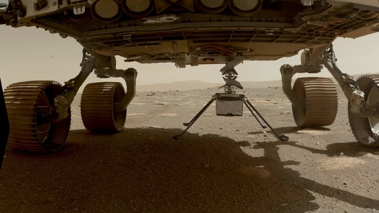 (FILES) This NASA photo obtained on April 6, 2021, shows NASA�s Ingenuity Mars Helicopter with all four of its legs deployed before dropping from the belly of the Perseverance rover on March 30, 2021. (AFP Photo ) (FILES) This NASA photo obtained on April 6, 2021, shows NASA�s Ingenuity Mars Helicopter with all four of its legs deployed before dropping from the belly of the Perseverance rover on March 30, 2021. (AFP Photo )