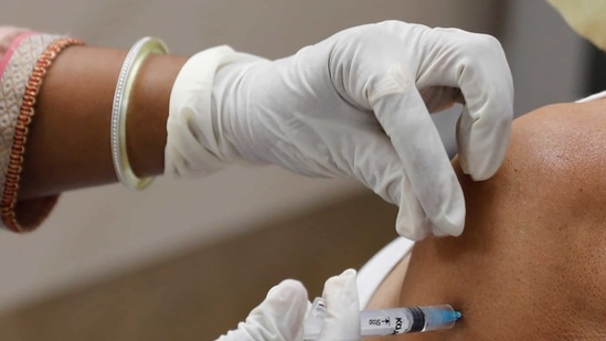 A health worker administers a vaccine for Covid-19 at Moti Lal Nehru Medical College in Uttar Pradesh's Prayagraj (AP). A health worker administers a vaccine for Covid-19 at Moti Lal Nehru Medical College in Uttar Pradesh's Prayagraj (AP).