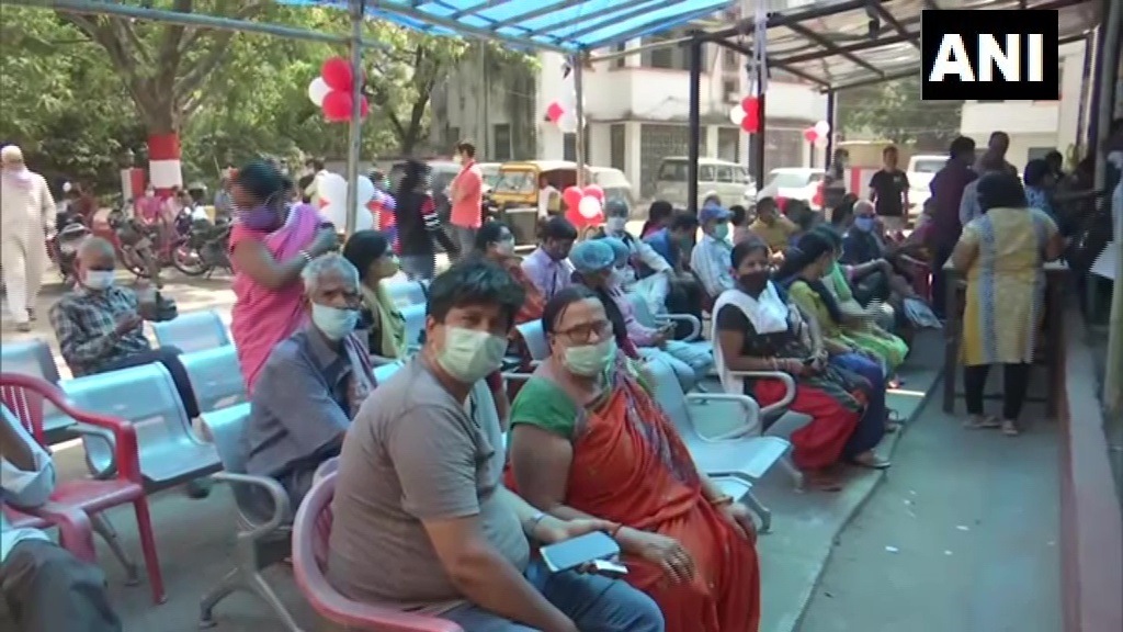 People wait outside a vaccination centre to get Covid-19 shot in Bihar's Patna on Sunday. (ANI Photo ) People wait outside a vaccination centre to get Covid-19 shot in Bihar's Patna on Sunday. (ANI Photo )