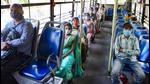 Passengers maintain social distancing while sitting in a bus, as DTC buses operate at 50% capacity, in New Delhi on April 11. (PTI) Passengers maintain social distancing while sitting in a bus, as DTC buses operate at 50% capacity, in New Delhi on April 11. (PTI)
