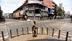 A man walks along a deserted street during a weekend lockdown imposed by the state government amidst rising Covid-19 coronavirus cases, in Pune. ( AFP) A man walks along a deserted street during a weekend lockdown imposed by the state government amidst rising Covid-19 coronavirus cases, in Pune. ( AFP)