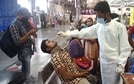 A health worker collects a nasal sample from a passenger for COVID-19 test, at the Chhatrapati Shivaji Maharaj terminus in Mumbai. (PTI Photo) A health worker collects a nasal sample from a passenger for COVID-19 test, at the Chhatrapati Shivaji Maharaj terminus in Mumbai. (PTI Photo)