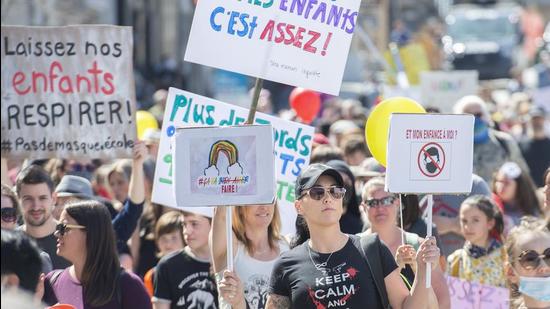 People take part in a demonstration in Montreal, opposing the Quebec administration’s health and safety measures to curb the spread of Covid-19 in schools as the pandemic continues in Canada and around the world. (AP)