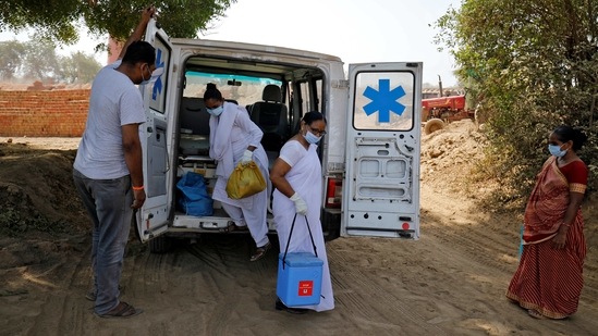 Gujarat reported 5,469 new cases of coronavirus on Sunday, its biggest single-day rise. In picture - Healthcare workers arrive with doses of Covishield vaccine at a village on the outskirts of Ahmedabad. (Reuters)