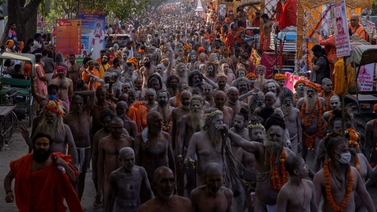 Naga Sadhus, or Hindu holy men participate in the procession for taking a dip in the Ganges river during Shahi Snan at "Kumbh Mela", or the Pitcher Festival, amidst the spread of the coronavirus disease (Covid-19), in Haridwar, India. (Reuters)