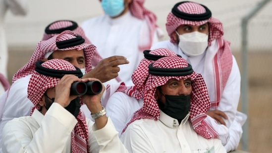 A member of the moon sighting committee looks through binoculars to view the moon ahead of Ramadan to mark the beginning of the holy fasting month, near Riyadh, Saudi Arabia, April 12, 2021. REUTERS/Ahmed Yosri(REUTERS)