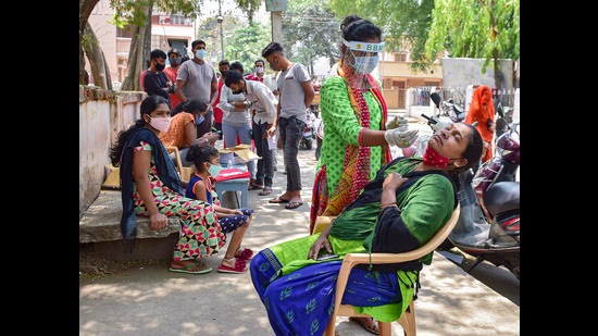 Bengaluru: A health worker collects samples for COVID-19 testing amid surge in coronavirus cases, in Bengaluru, Saturday, April 10, 2021. (PTI Photo/Shailendra Bhojak)(PTI04_10_2021_000193A) (PTI) Bengaluru: A health worker collects samples for COVID-19 testing amid surge in coronavirus cases, in Bengaluru, Saturday, April 10, 2021. (PTI Photo/Shailendra Bhojak)(PTI04_10_2021_000193A) (PTI)