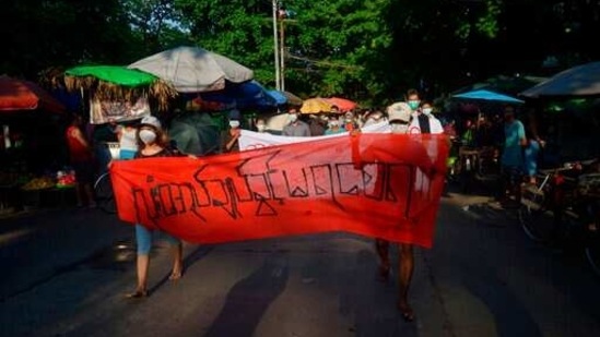 People march to protest against the military coup in February, in Yangon, Myanmar. (AP) People march to protest against the military coup in February, in Yangon, Myanmar. (AP)