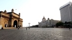 A deserted view of the road in front of the Gateway of India, Taj Mahal Palace, and The Oberai Hotel during a weekend lockdown, in Mumbai on Sunday. (ANI Photo) A deserted view of the road in front of the Gateway of India, Taj Mahal Palace, and The Oberai Hotel during a weekend lockdown, in Mumbai on Sunday. (ANI Photo)