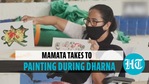Mamata sits on dharna against EC's campaign ban, paints in silent protest Mamata sits on dharna against EC's campaign ban, paints in silent protest