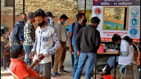 People wait to get vaccinated against Covid-19 at corporation dispensary, Sangli, Maharashtra. (HT file) People wait to get vaccinated against Covid-19 at corporation dispensary, Sangli, Maharashtra. (HT file)