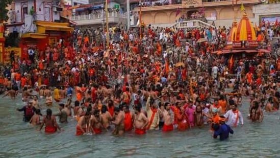 Devotees take holy dips in the Ganga in Haridwar on Monday.(AP Photo)