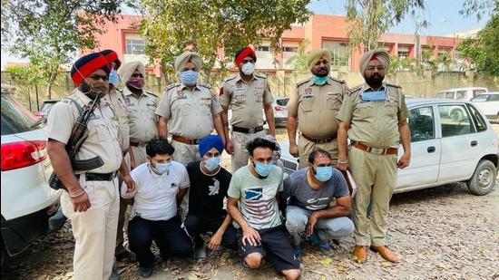The accused, who conspired to kill Rajinder Singh and executed the murder, in the custody of Sadar Raikot police in Ludhiana on Tuesday. (HT Photo) The accused, who conspired to kill Rajinder Singh and executed the murder, in the custody of Sadar Raikot police in Ludhiana on Tuesday. (HT Photo)