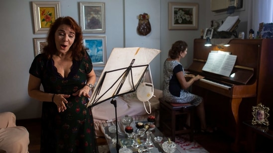 Municipal Theatre soprano opera singer Georgia Szpilman practices at her coach's home during the Covid-19 pandemic in Rio de Janeiro, Brazil, Thursday, March 25, 2021.(AP) Municipal Theatre soprano opera singer Georgia Szpilman practices at her coach's home during the Covid-19 pandemic in Rio de Janeiro, Brazil, Thursday, March 25, 2021.(AP)