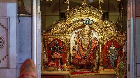 A devotee at the Jhandewalan Devi temple on the eve of Navratri festival, in New Delhi on Monday, April 12. The temple is now closed for devotees in the view of a surge in Covid-19 cases. (PTI) A devotee at the Jhandewalan Devi temple on the eve of Navratri festival, in New Delhi on Monday, April 12. The temple is now closed for devotees in the view of a surge in Covid-19 cases. (PTI)
