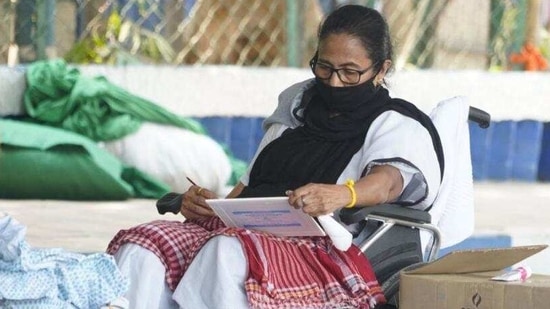 Mamata Banerjee took to painting during her dharna against the Election Commission. (TMC) Mamata Banerjee took to painting during her dharna against the Election Commission. (TMC)