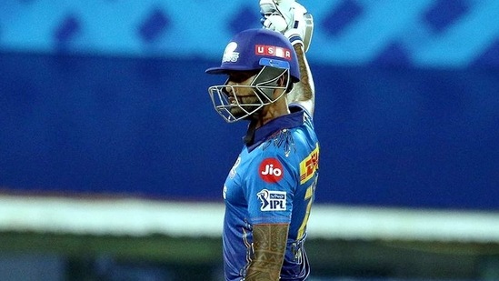 Suryakumar Yadav of Mumbai Indians raises his bat after scoring fifty runs.(PTI)