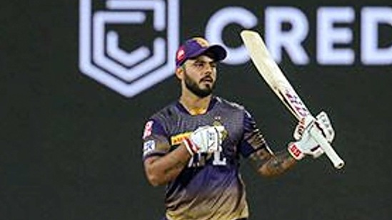 Nitish Rana of Kolkata Knight Riders raises his bat after scoring a fifty.(PTI)